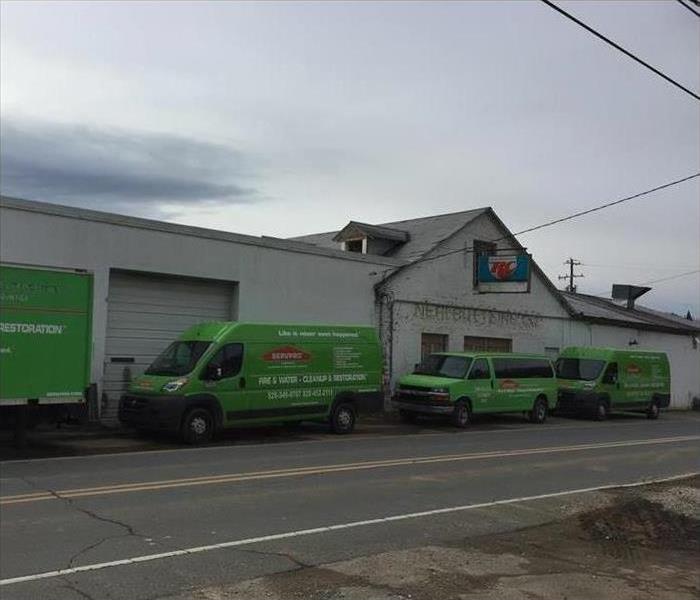 SERVPRO vehicles parked in the street